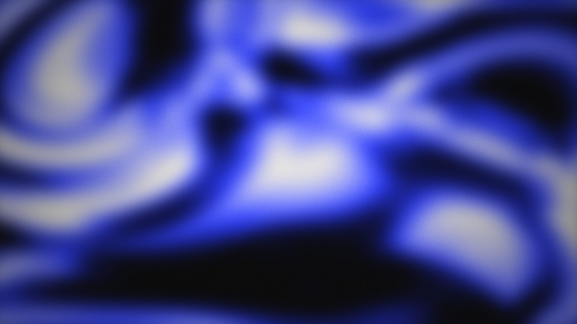 Cobalt light moving across a dark surface